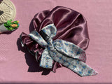 Satin bonnet with floral tie