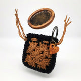 Resin worry stone with crochet pouch