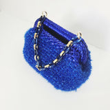 Crocheted sparkly blue clutch bag