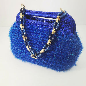 Crocheted sparkly blue clutch bag