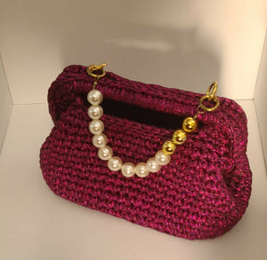 Crochet festive fuchsia clutch