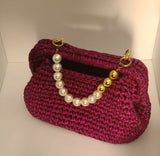 Crochet festive fuchsia clutch
