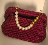 Crochet festive fuchsia clutch
