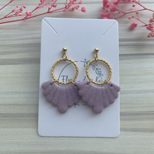Olga in purple/gold earrings