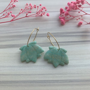 Lily in green-gold hoop earrings