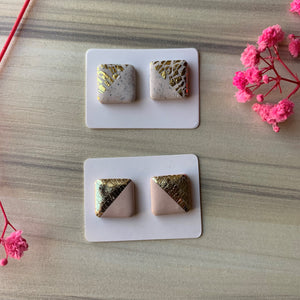 Studs in beige or cream