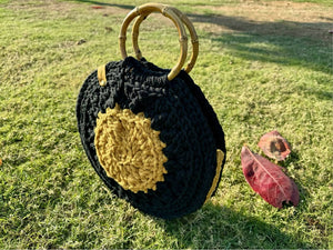 Round yellow-black handbag