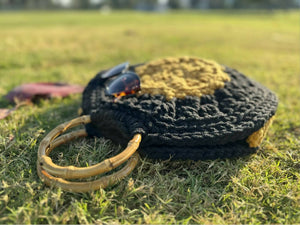 Round yellow-black handbag